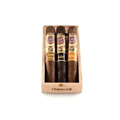 Three capa flor cigars in a wooden display case on a white background