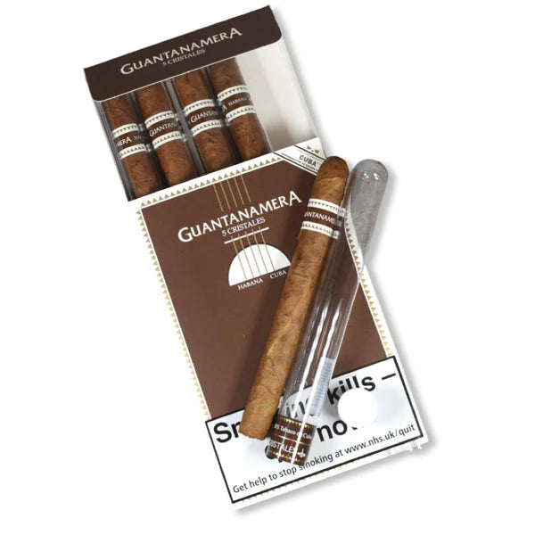 Pack of Guantanamera cigars with an opened cigar on a white background