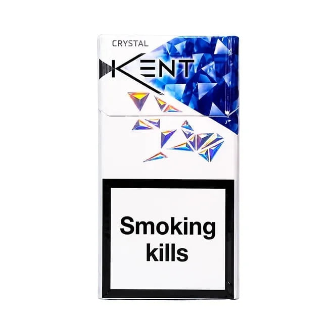 A pack of Kent Crystal cigarettes on a plain white background. The pack is white with a blue faceted crystal graphic on the upper right and a black warning label on the lower half that reads 'Smoking kills'.