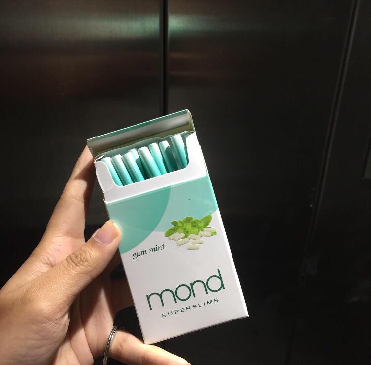 mond gum mint cigarette open pack in hand